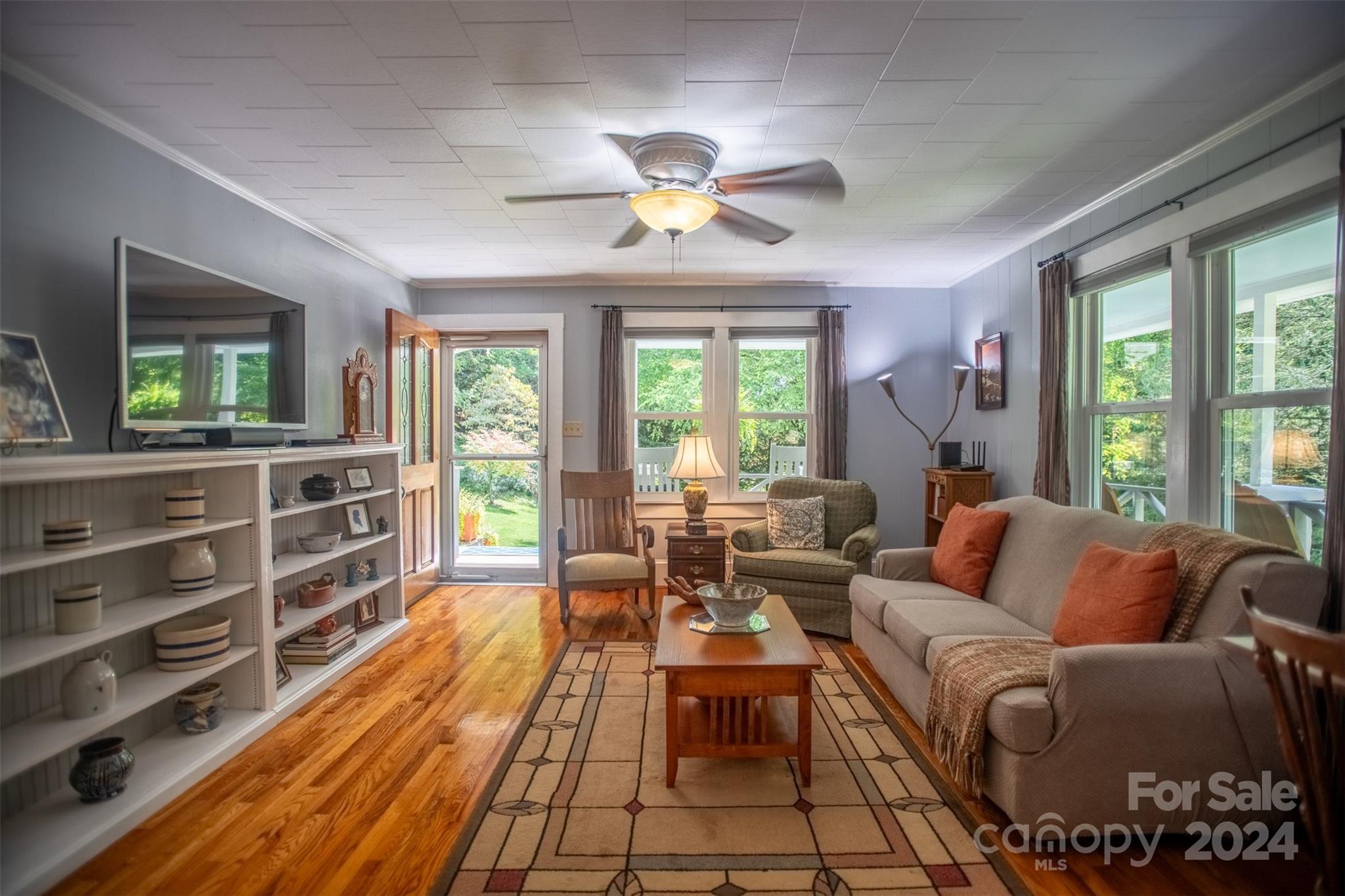 296 Sparks Road Bakersville, NC 28705 - Photo 2 of 47 a living room with furniture a ceiling fan and a large window