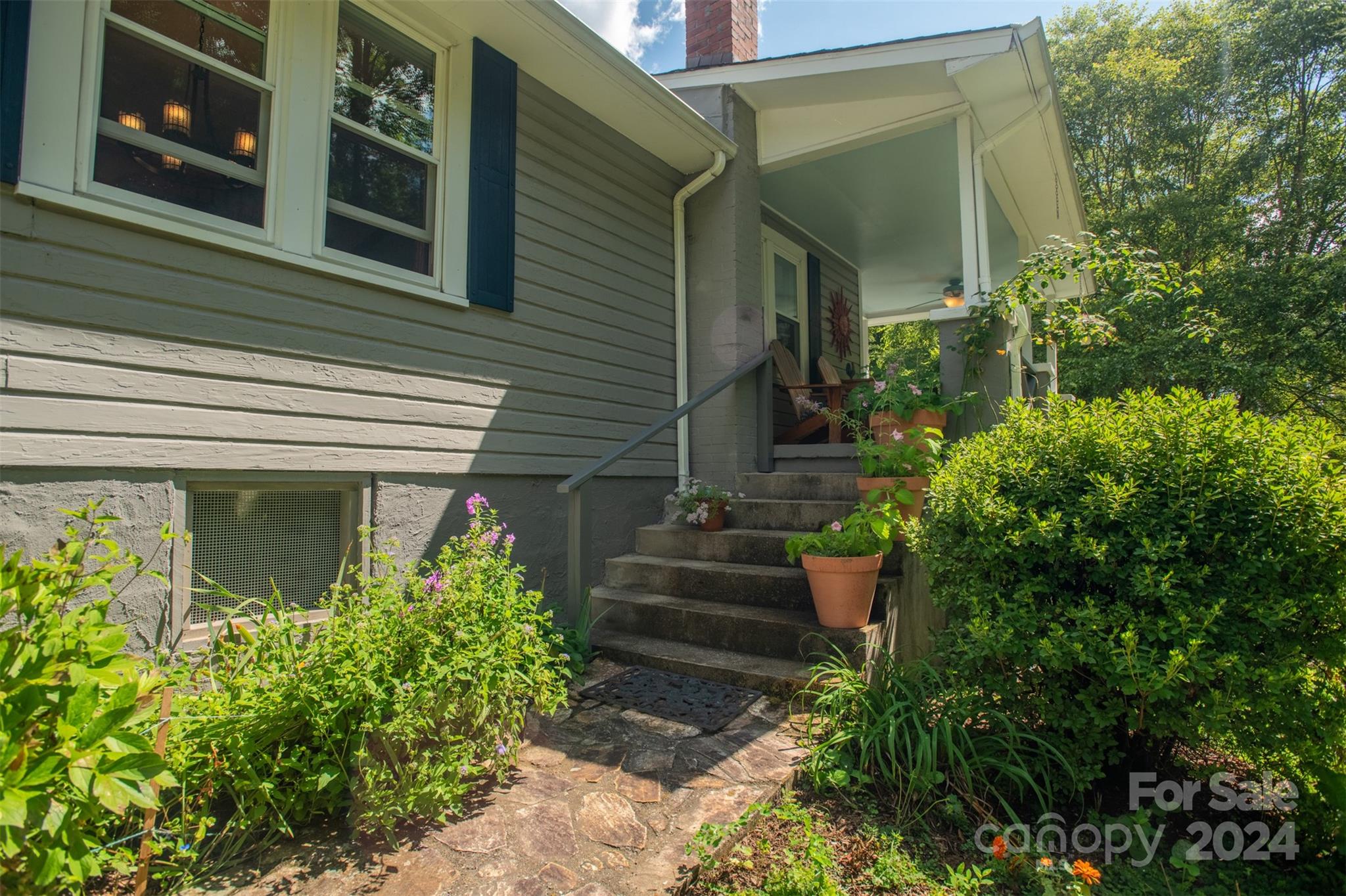 296 Sparks Road Bakersville, NC 28705 - Photo 26 of 47 a view of a house with potted plants