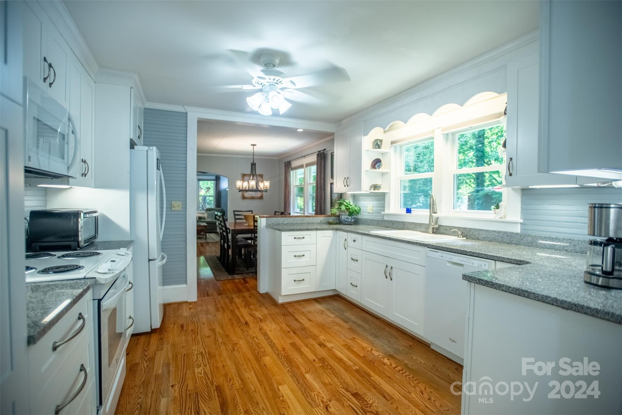 296 Sparks Road Bakersville, NC 28705 - Photo 37 of 47 a large kitchen with a large window appliances and cabinets