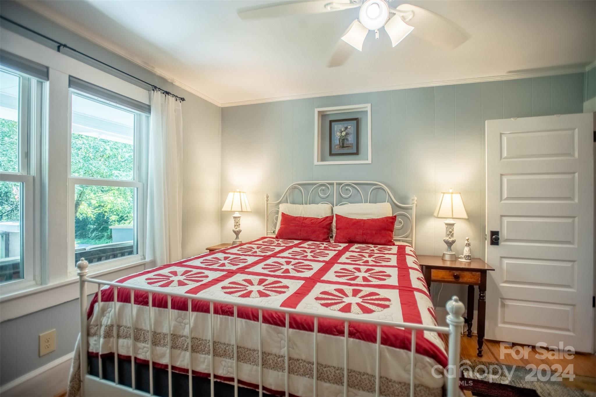 296 Sparks Road Bakersville, NC 28705 - Photo 40 of 47 a bedroom with a large bed and a window