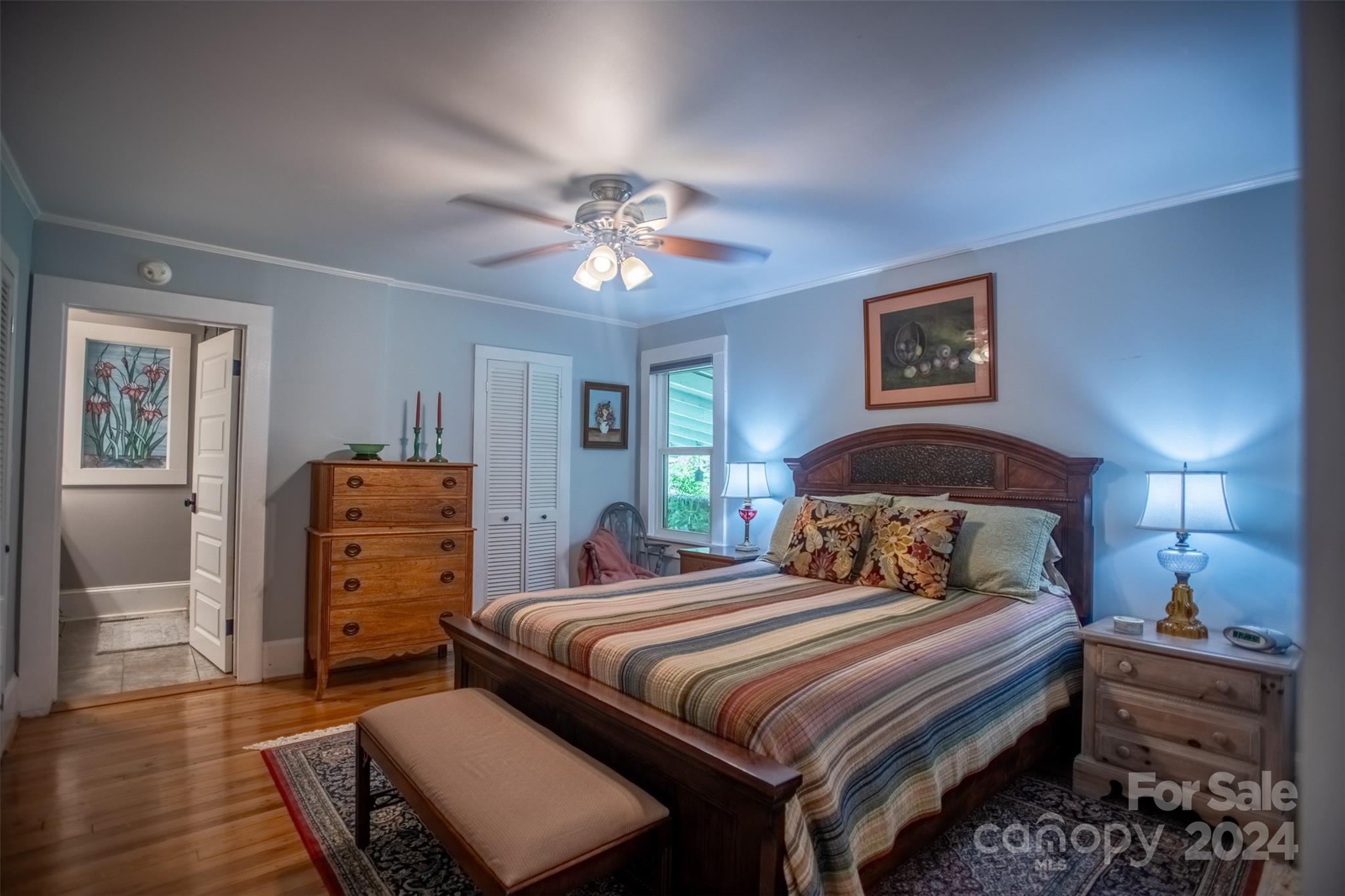 296 Sparks Road Bakersville, NC 28705 - Photo 42 of 47 a bedroom with a bed and wooden floor