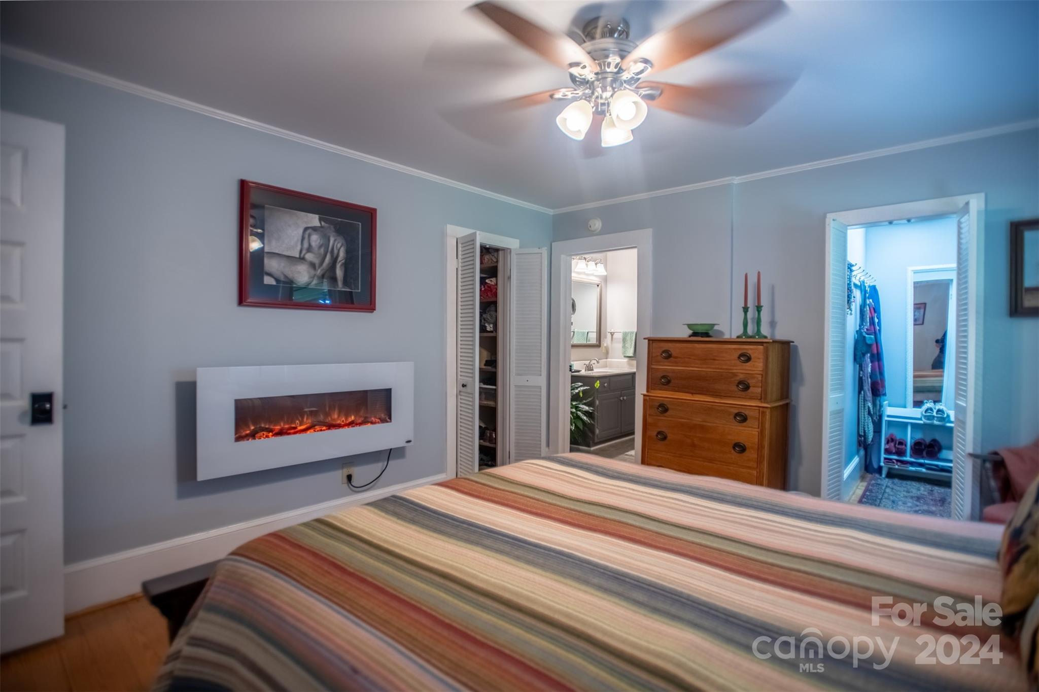296 Sparks Road Bakersville, NC 28705 - Photo 45 of 47 a bedroom with bed and a chandelier