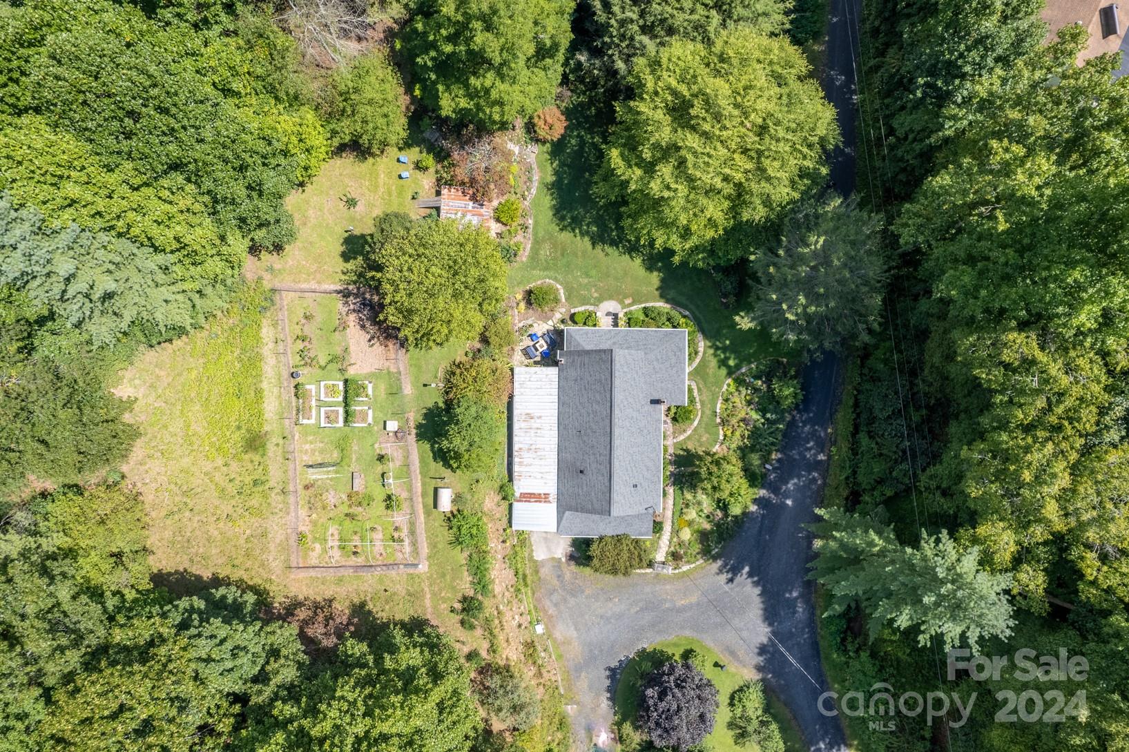 296 Sparks Road Bakersville, NC 28705 - Photo 47 of 47 an aerial view of a house with a yard