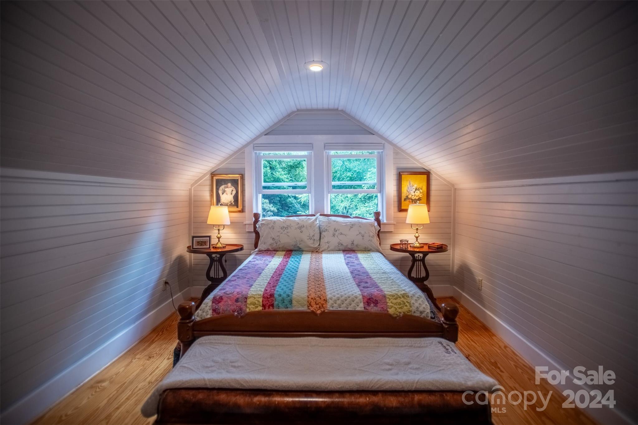 296 Sparks Road Bakersville, NC 28705 - Photo 8 of 47 a bed sitting in a bedroom next to a window