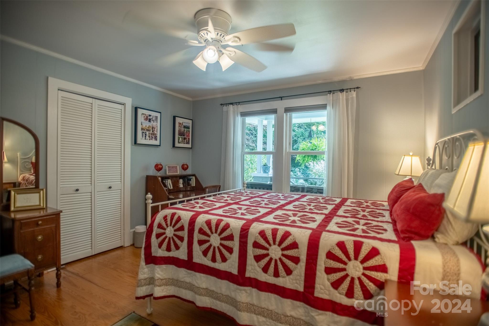 296 Sparks Road Bakersville, NC 28705 - Photo 9 of 47 a bedroom with a bed and a chandelier