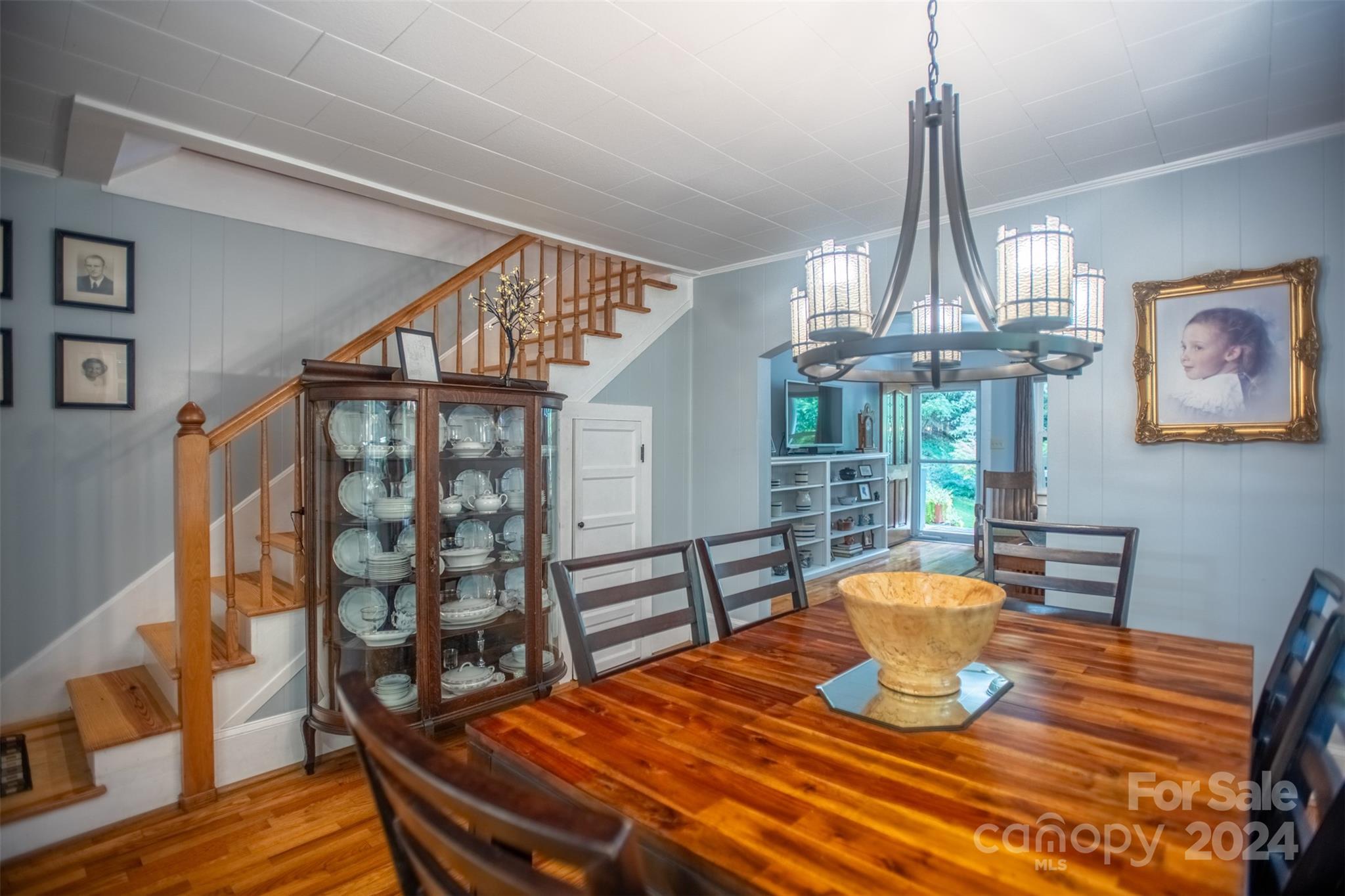 296 Sparks Road Bakersville, NC 28705 - Photo 10 of 47 a view of a dining room with furniture wooden floor and chandelier