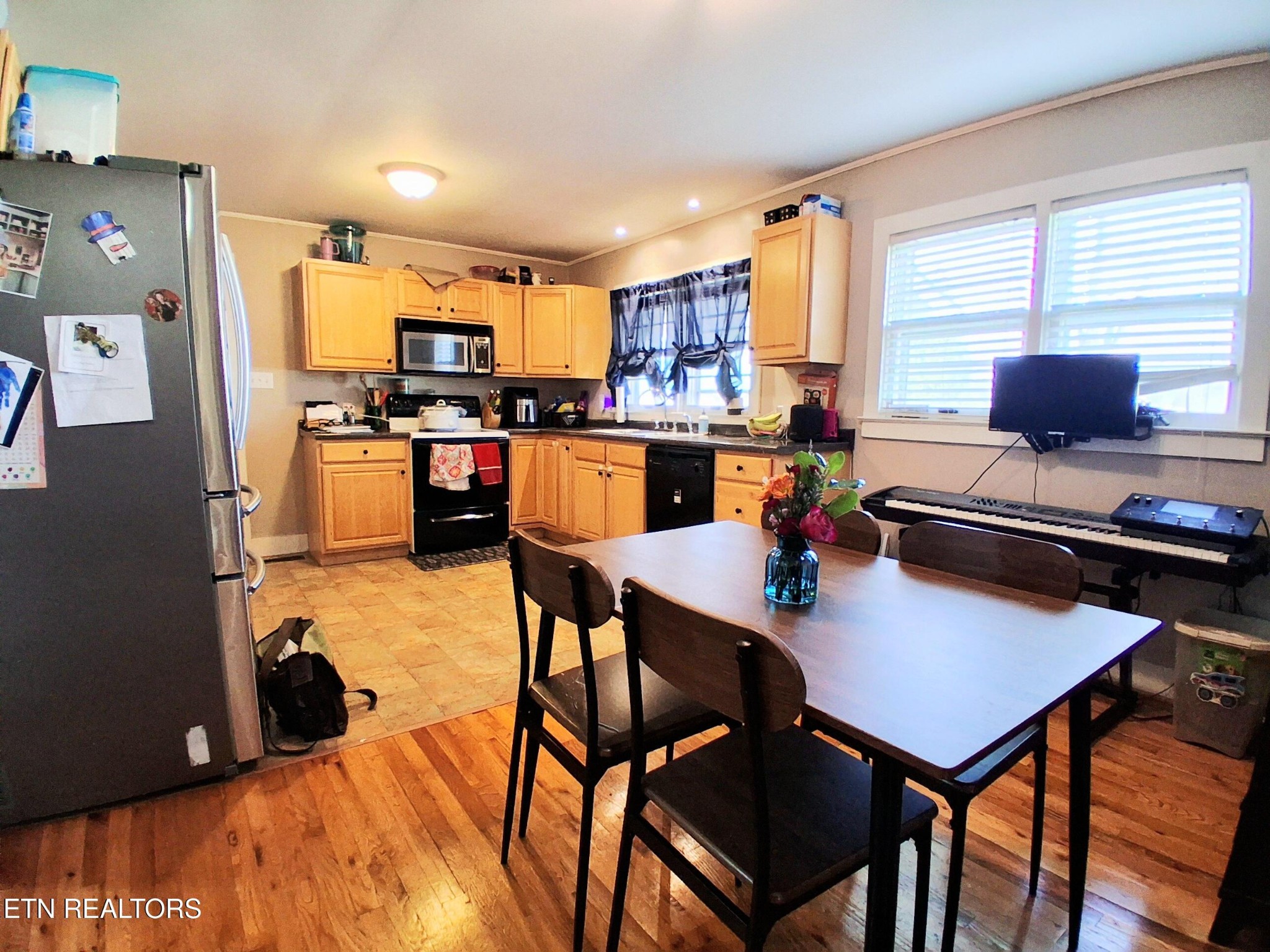 71 Basham Road Morrison, TN 37357 - Photo 5 of 17 a kitchen with a dining table and chairs