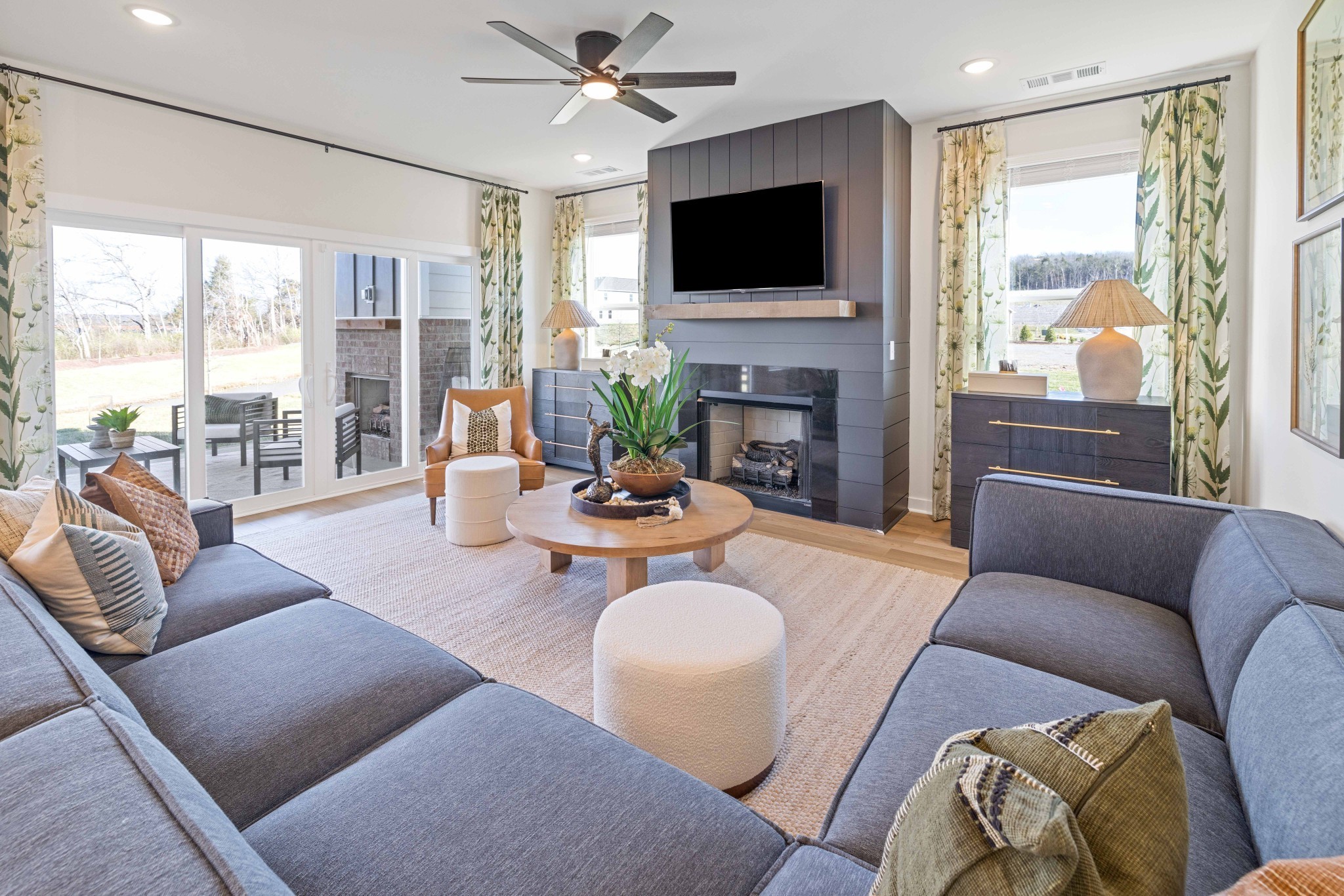 4166 Dream Beetle Loop Rockvale, TN 37153 - Photo 20 of 45 a living room with furniture a fireplace and a flat screen tv