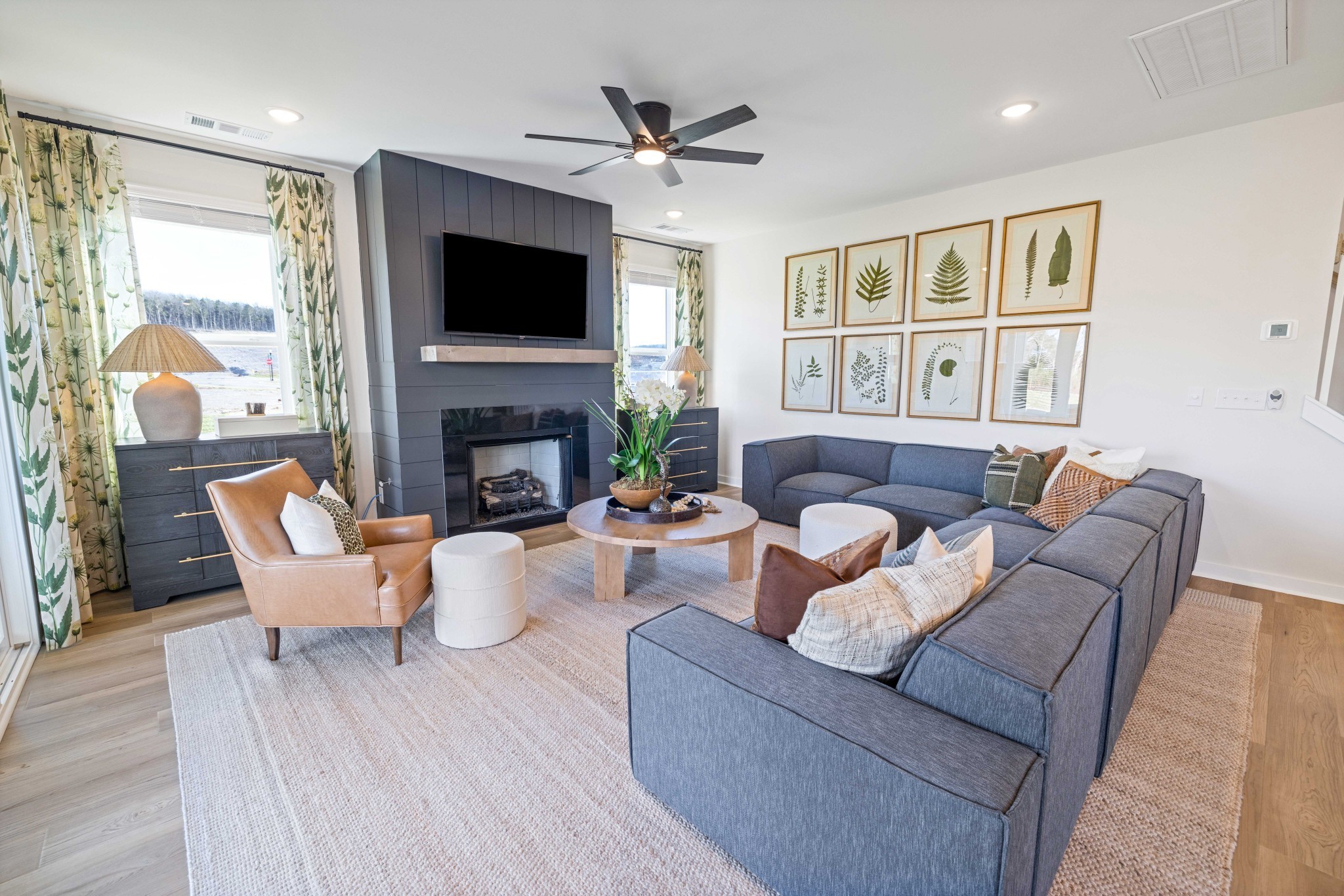 4166 Dream Beetle Loop Rockvale, TN 37153 - Photo 21 of 45 a living room with furniture a fireplace and a flat screen tv