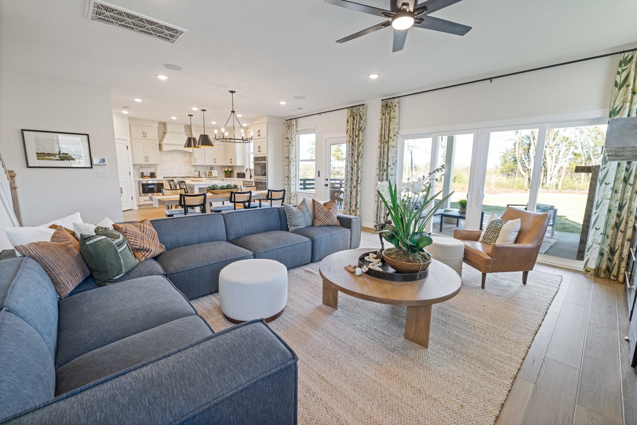 4166 Dream Beetle Loop Rockvale, TN 37153 - Photo 23 of 45 a living room with furniture potted plant and a large window