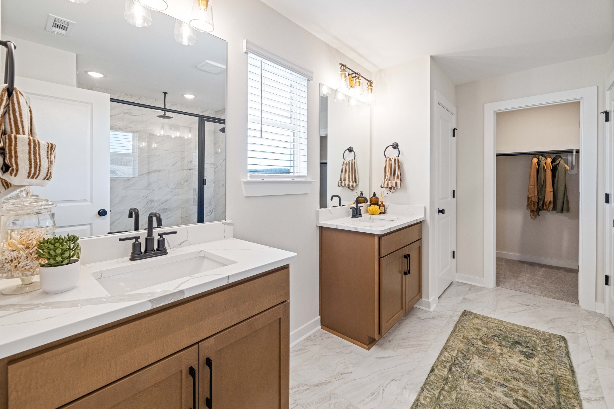 4166 Dream Beetle Loop Rockvale, TN 37153 - Photo 41 of 45 a spacious bathroom with a sink double vanity and a mirror