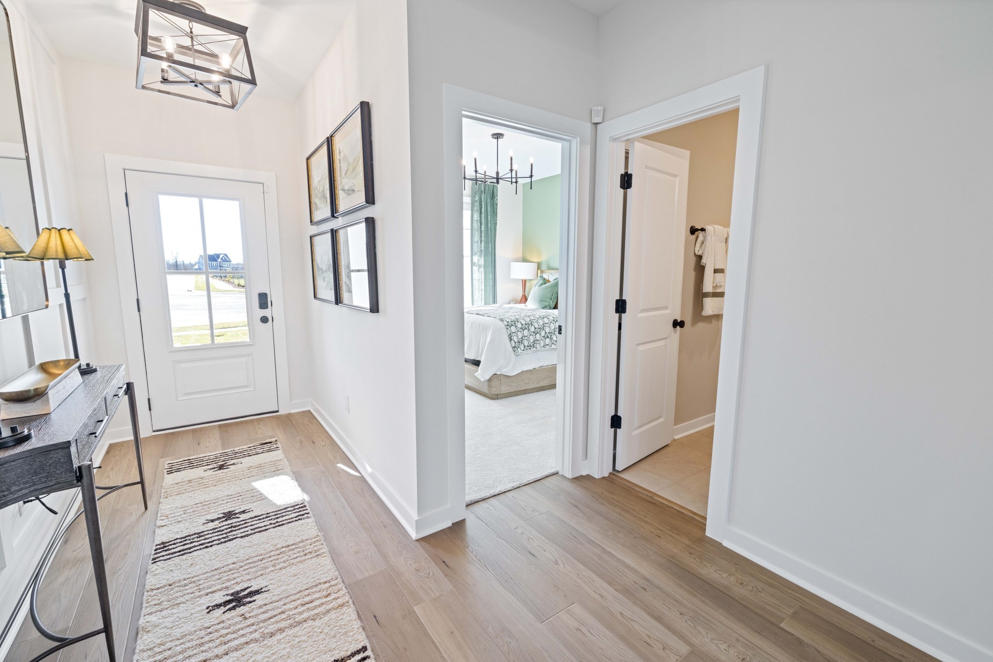 4166 Dream Beetle Loop Rockvale, TN 37153 - Photo 5 of 45 a view of a hallway with wooden floor and a living room