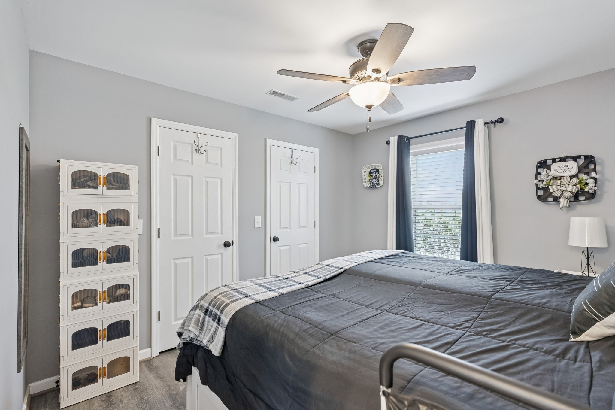 403 Bland Road Estill Springs, TN 37330 - Photo 22 of 66 a bedroom with a bed and a chandelier