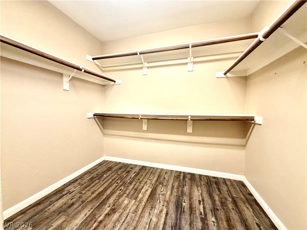 3936 Gold Point Street Las Vegas, NV 89129 - Photo 14 of 23 Ample shelving and hanging space defines this versatile walk-in closet, ready for personalized organization.
