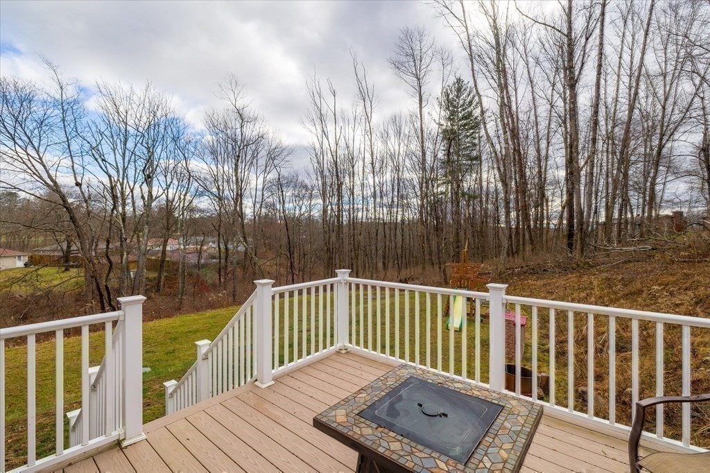 71 Dudley Hill Road Dudley, MA 01571 - Photo 26 of 32 a view of a wooden roof deck