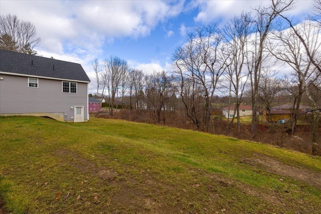 71 Dudley Hill Road Dudley, MA 01571 - Photo 30 of 32 a view of back yard of the house
