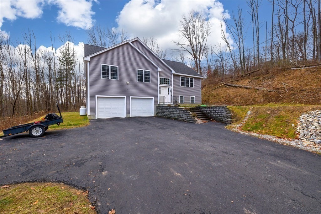 71 Dudley Hill Road Dudley, MA 01571 - Photo 3 of 32 a view of backyard of house