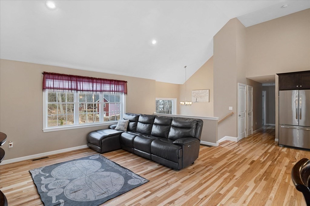 71 Dudley Hill Road Dudley, MA 01571 - Photo 8 of 32 a living room with furniture and a window