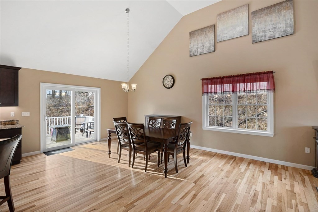 71 Dudley Hill Road Dudley, MA 01571 - Photo 9 of 32 a view of a dining room with furniture and wooden floor