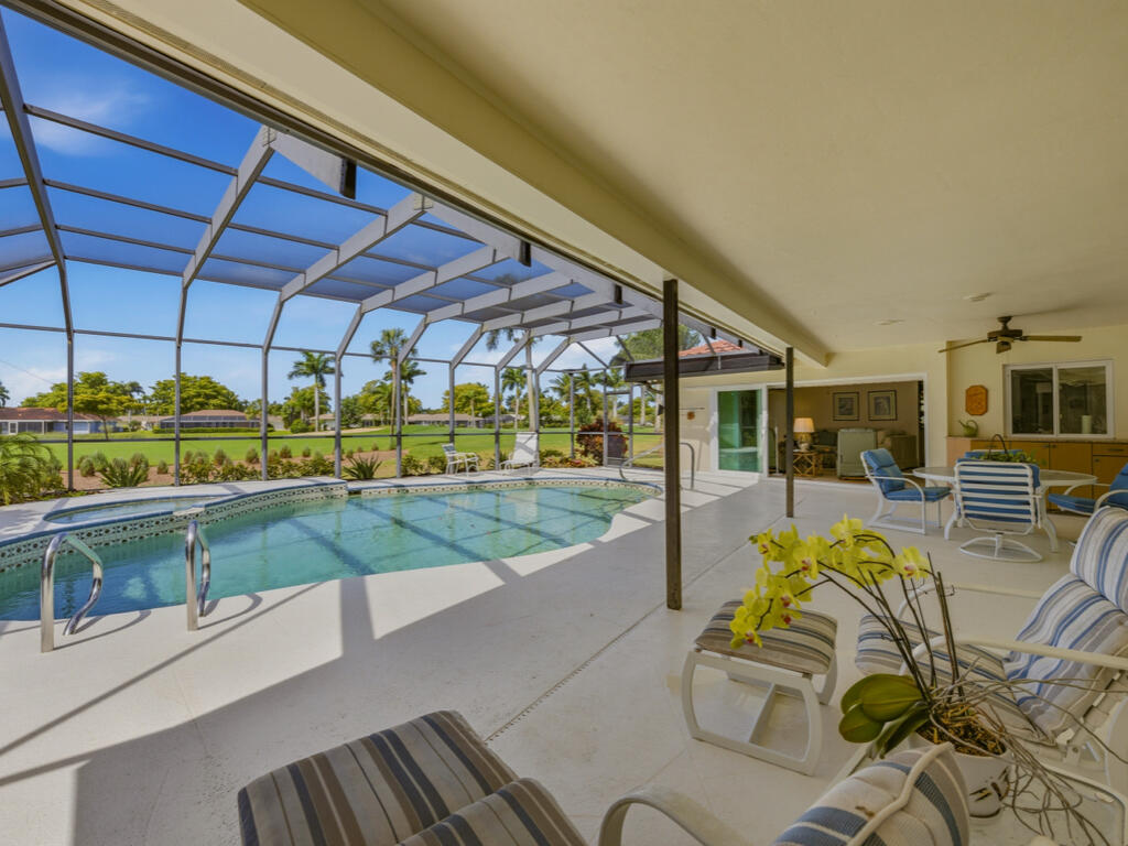 314 Torrey Pines Point Naples, FL 34113 - Photo 20 of 21 a view of a swimming pool with a patio