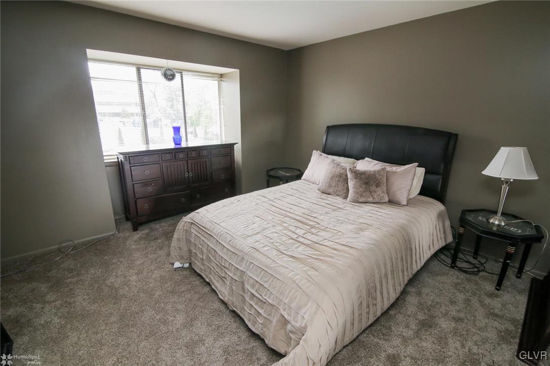 1575 Creekside Road, Unit A5 Whitehall, PA 18052 - Photo 11 of 24 a bedroom with bed and window