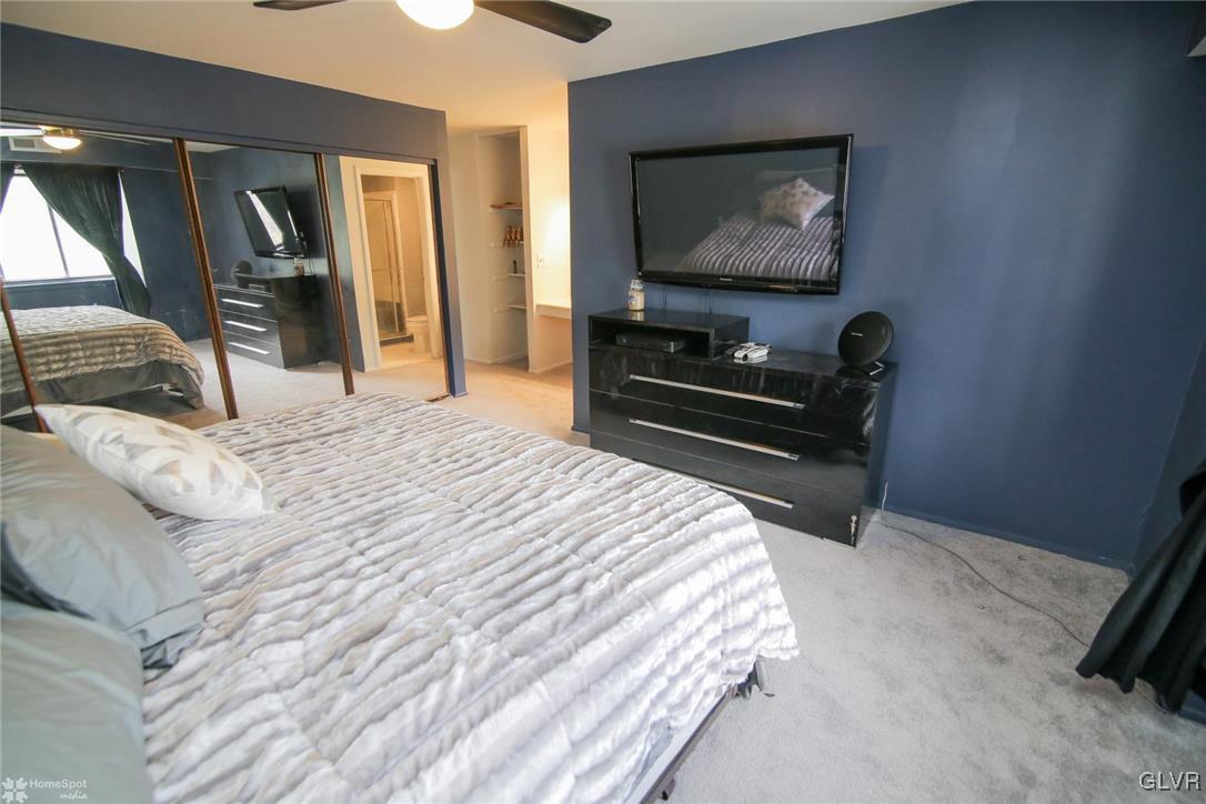 1575 Creekside Road, Unit A5 Whitehall, PA 18052 - Photo 17 of 24 a bedroom with a bed and a flat screen tv
