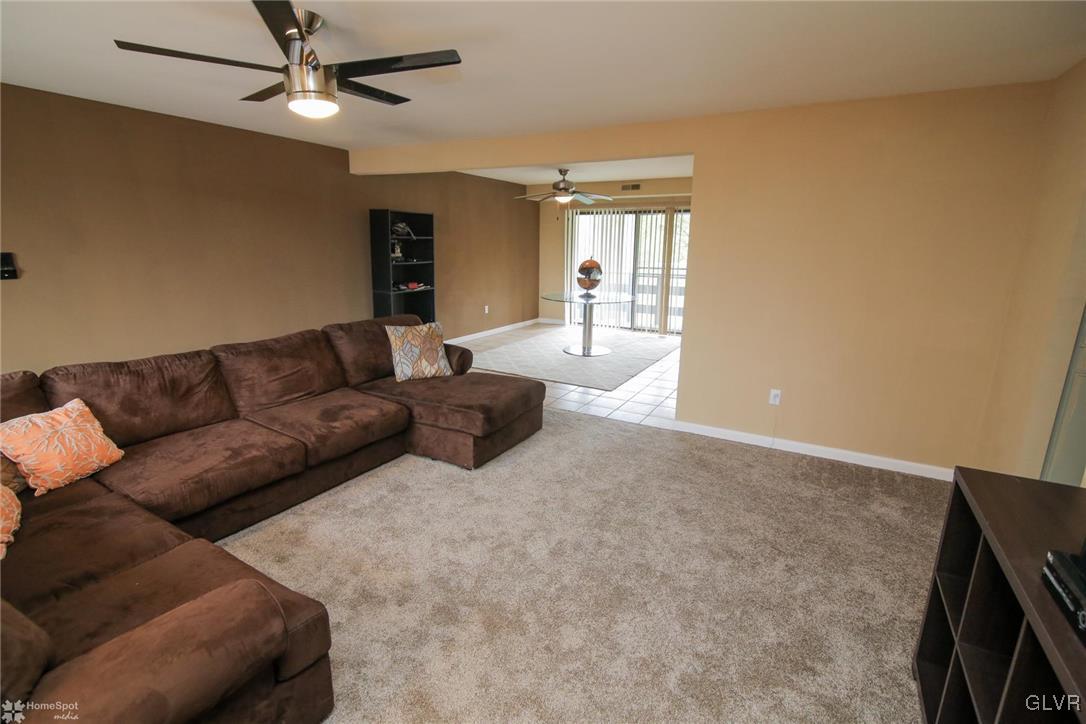 1575 Creekside Road, Unit A5 Whitehall, PA 18052 - Photo 6 of 24 a living room with furniture and a flat screen tv