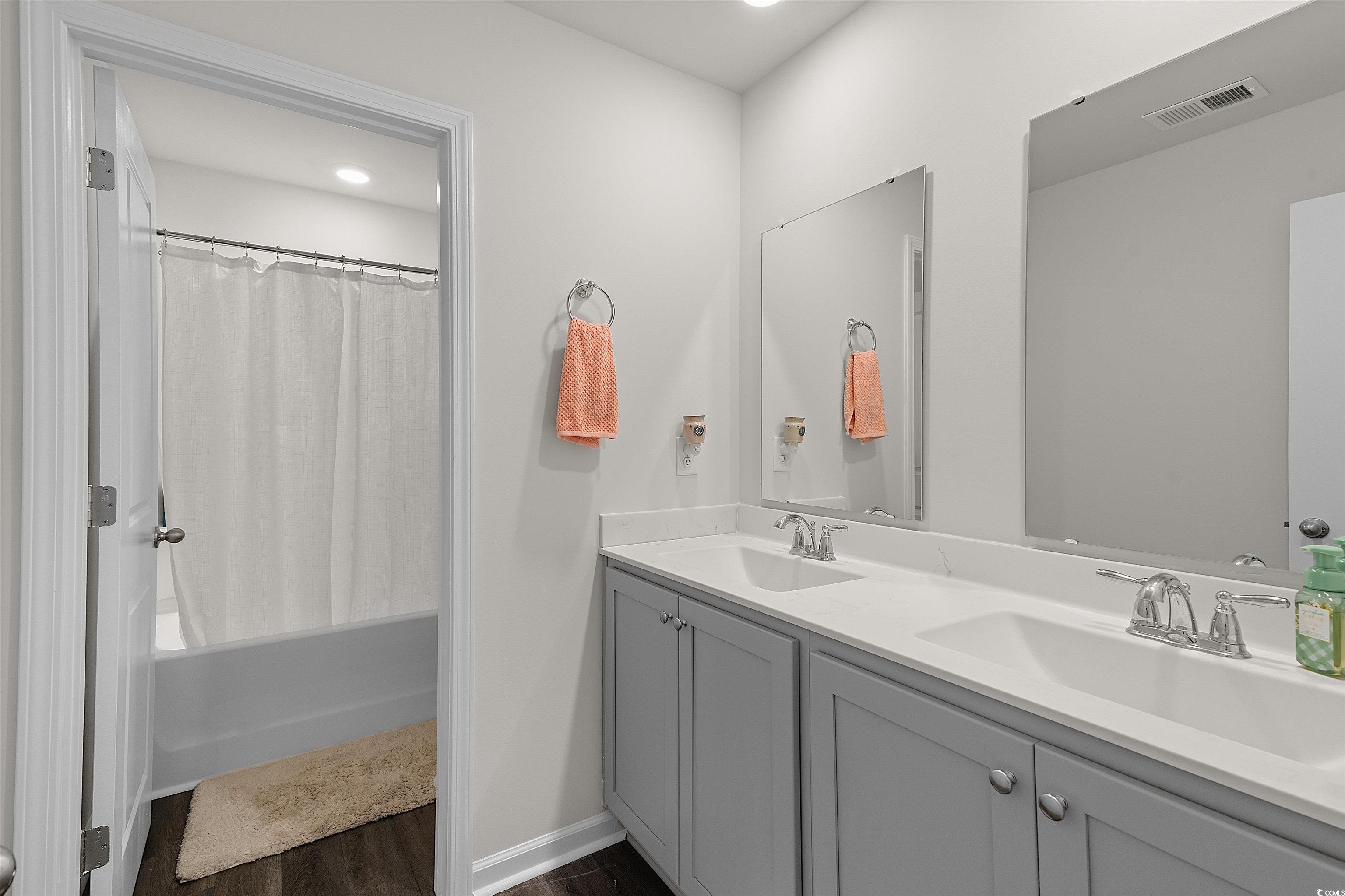 3119 Fair Rdg Way Conway, SC 29526 - Photo 21 of 38 Full bathroom featuring double vanity, wood finished floors, shower / bathtub combination with curtain, and recessed lighting