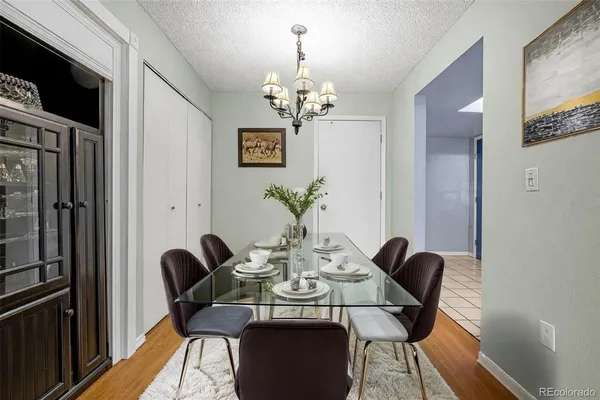 a view of a dining room with furniture and wooden floor