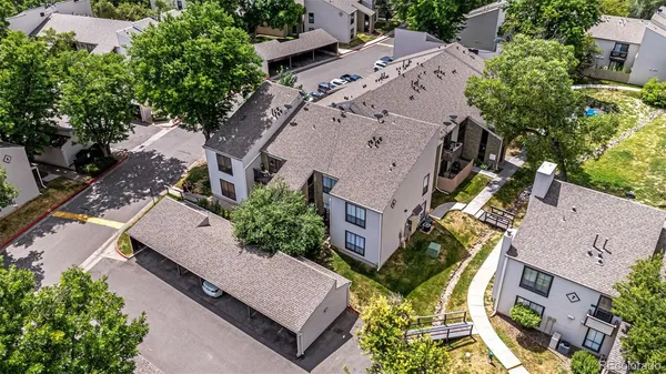 an aerial view of a house with garden space and street view