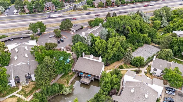 an aerial view of a house with a yard and lake view