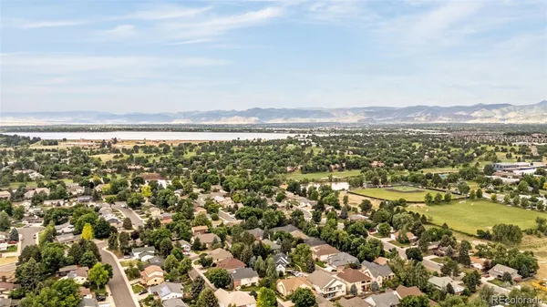 an aerial view of residential building and trees
