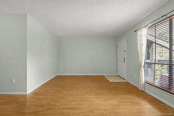 a view of an empty room and window