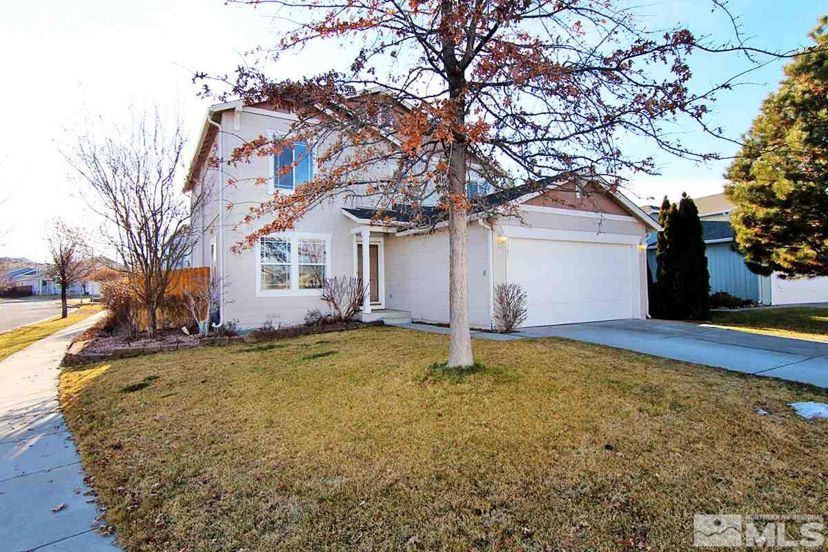 7762 Welsh Drive Reno, NV 89506 - Photo 1 of 25 a view of a house with a yard and large tree