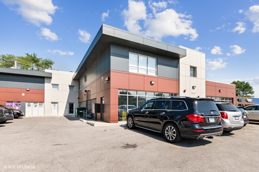 11933 South Pulaski Road, Unit 2 Alsip, IL 60803 - Photo 1 of 11 a view of a car parked in front of a house