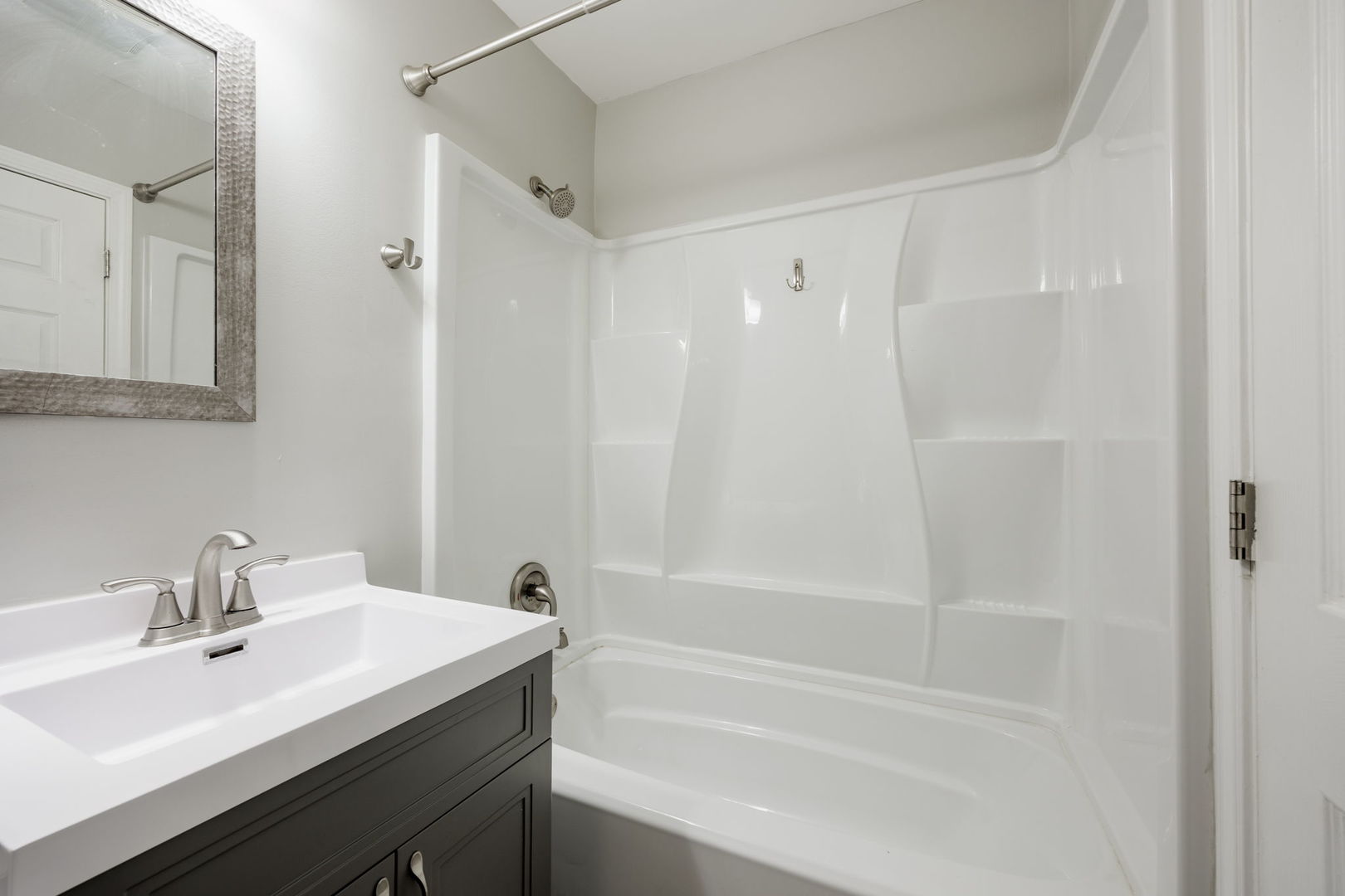 11933 South Pulaski Road, Unit 2 Alsip, IL 60803 - Photo 9 of 11 a bathroom with a bathtub shower sink and a sink