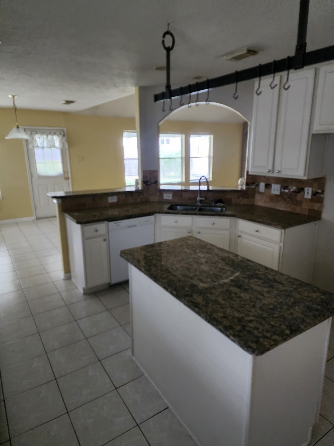 2314 Hannover Way Spring, TX 77388 - Photo 3 of 11 a kitchen with granite countertop a sink a counter top space and cabinets