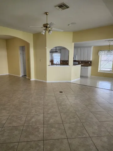 a view of a kitchen with a sink and a window