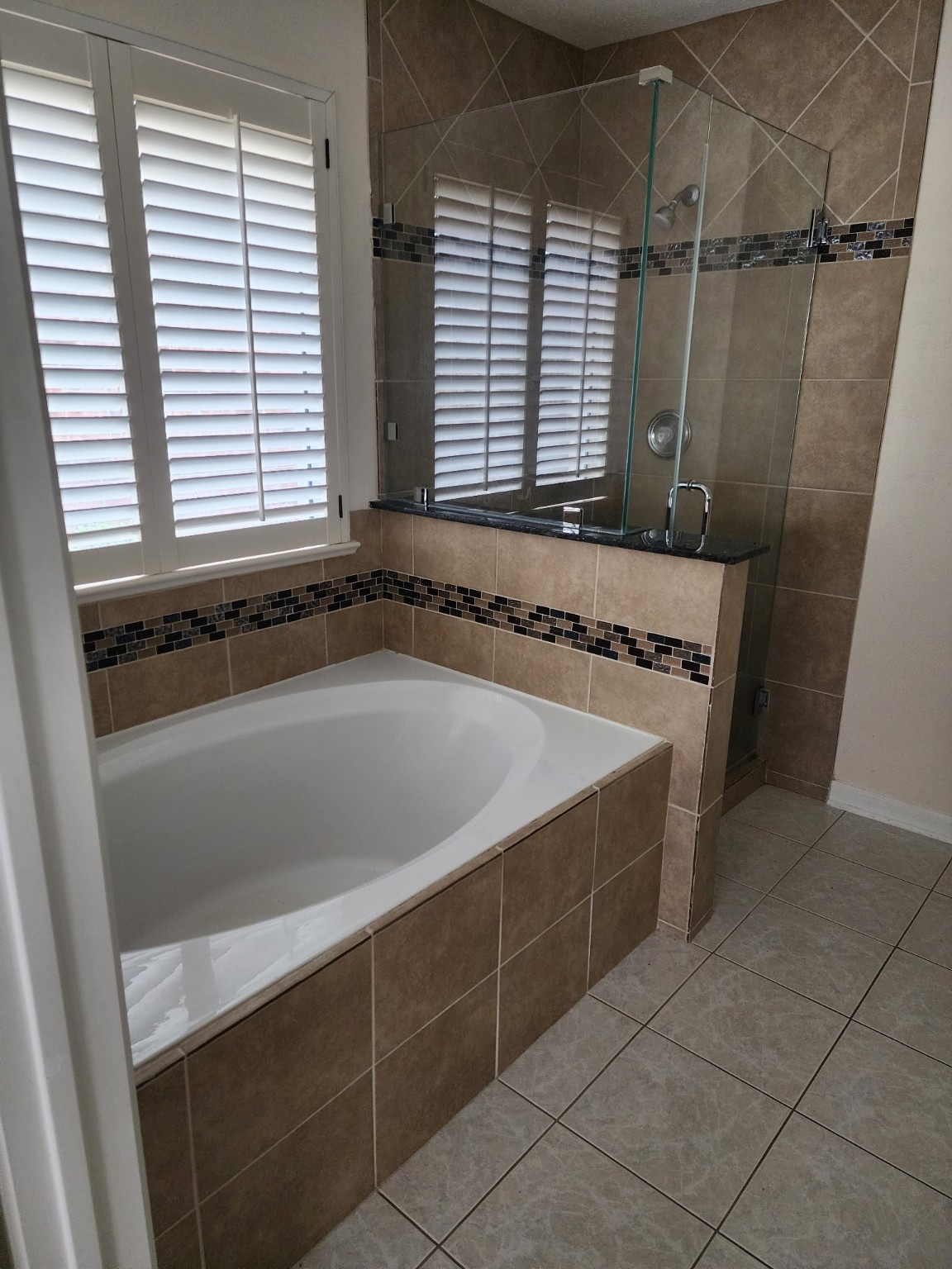 2314 Hannover Way Spring, TX 77388 - Photo 10 of 11 a bathroom with a bathtub and a shower