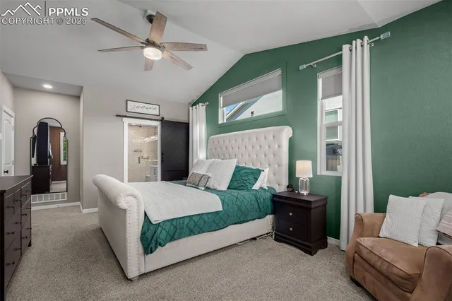 a living room with a bed furniture and a window