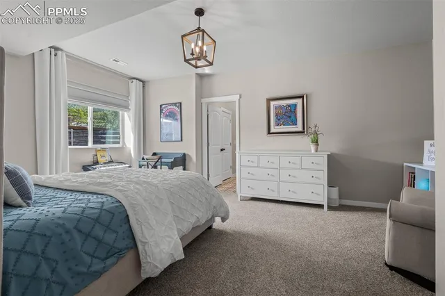 a spacious bedroom with a bed and a table