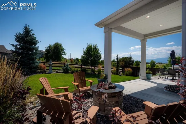a view of a chairs and table in patio