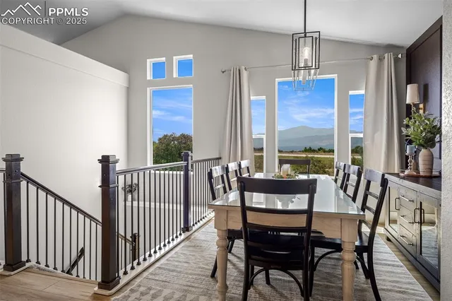 a view of a dining room with furniture window and outdoor view