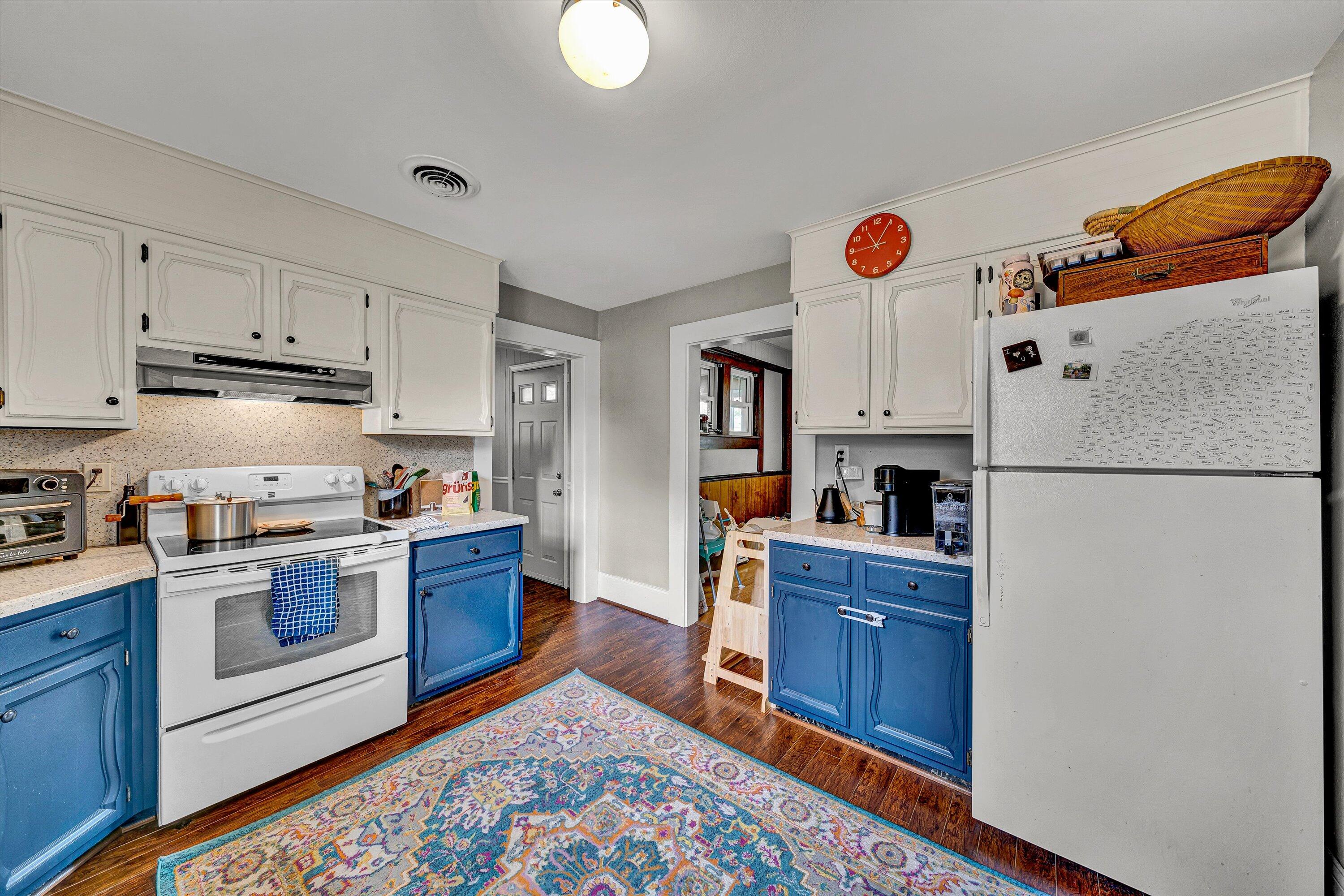 1907 Canterbury Road Southwest Roanoke, VA 24015 - Photo 12 of 36 a kitchen with stainless steel appliances granite countertop a refrigerator and a stove top oven