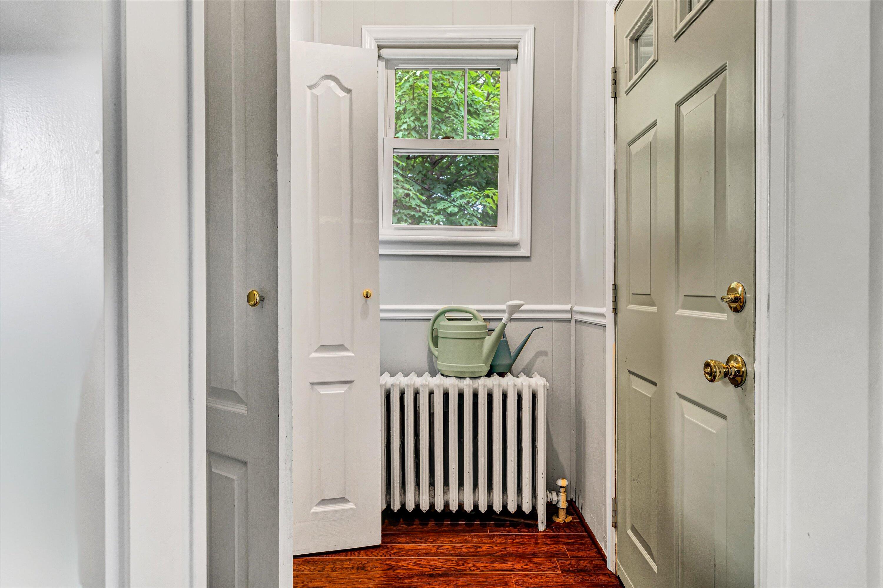 1907 Canterbury Road Southwest Roanoke, VA 24015 - Photo 13 of 36 a view of a hallway with wooden floor and a window