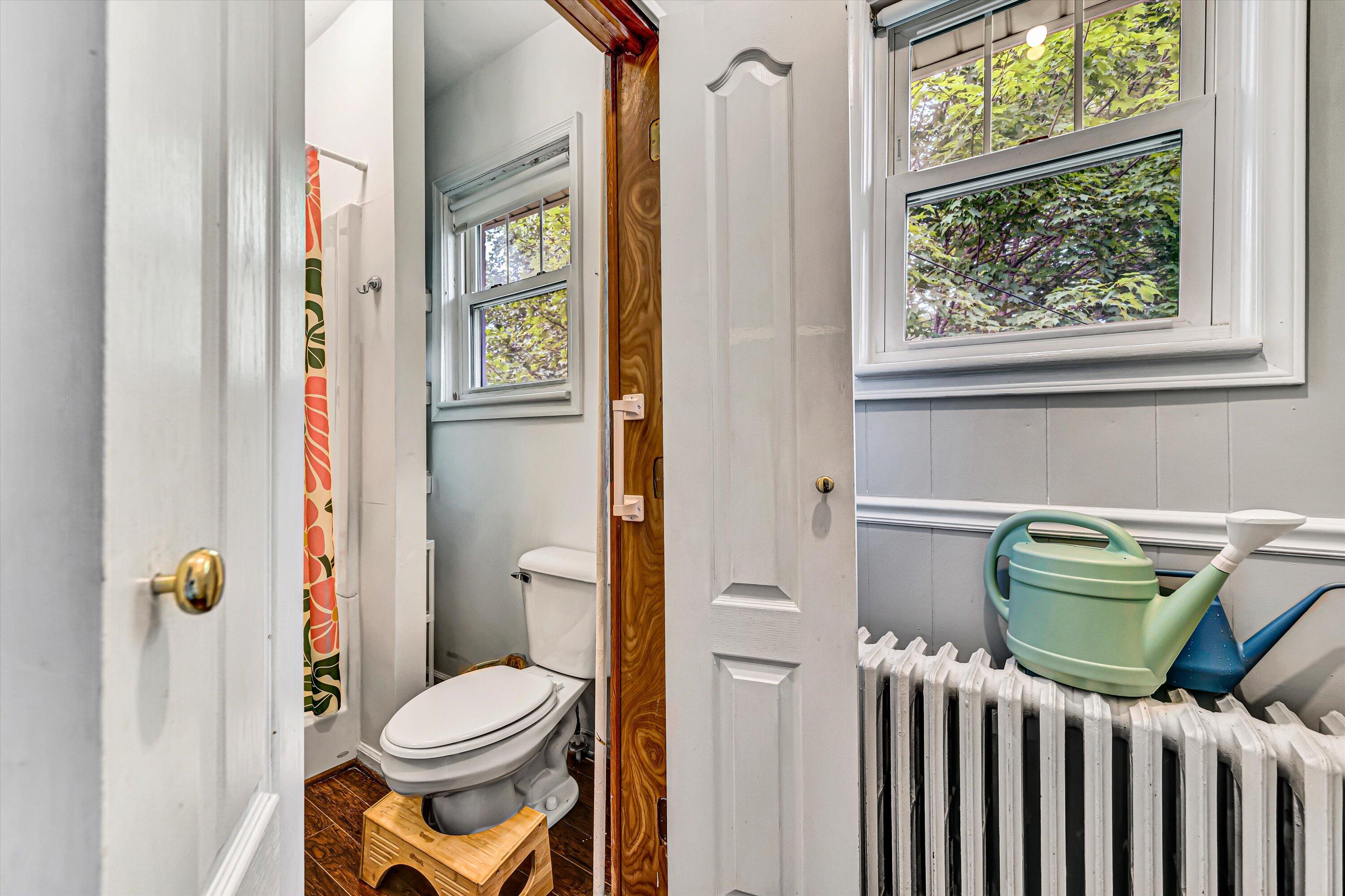 1907 Canterbury Road Southwest Roanoke, VA 24015 - Photo 14 of 36 a bathroom with a toilet and a window