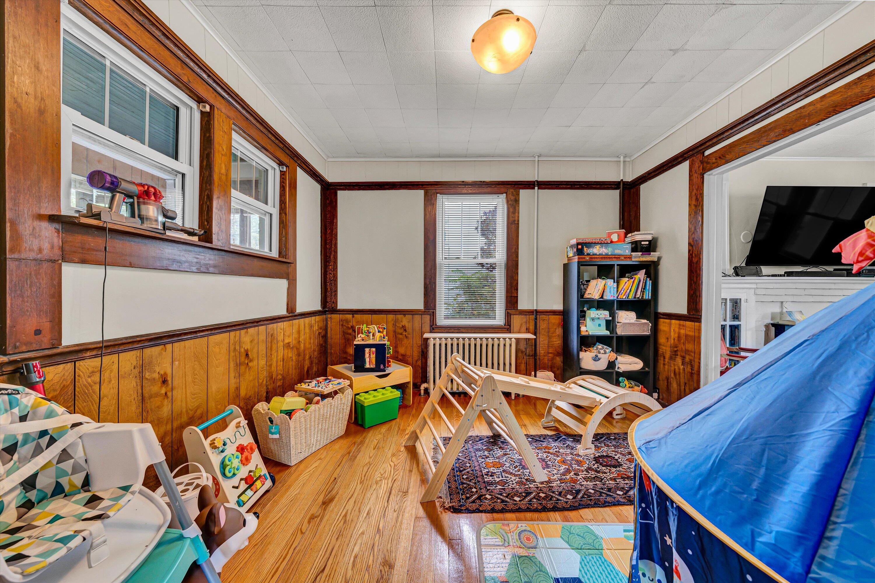 1907 Canterbury Road Southwest Roanoke, VA 24015 - Photo 17 of 36 a living room with furniture and a flat screen tv