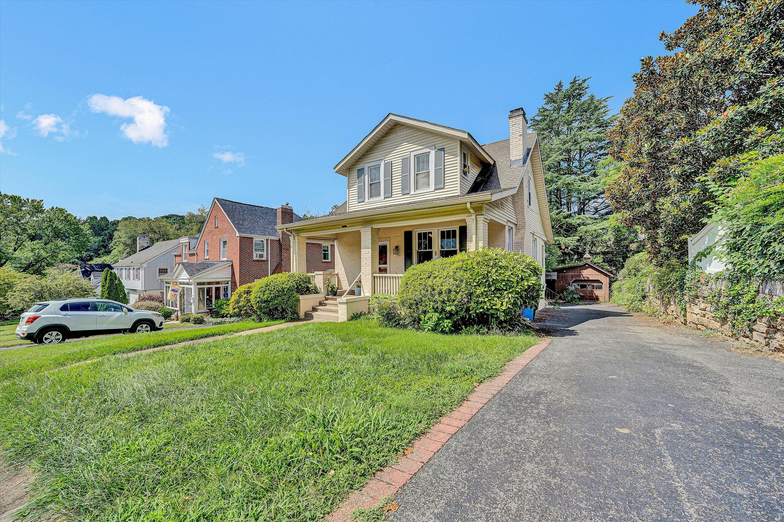 1907 Canterbury Road Southwest Roanoke, VA 24015 - Photo 2 of 36 a front view of a house with a garden