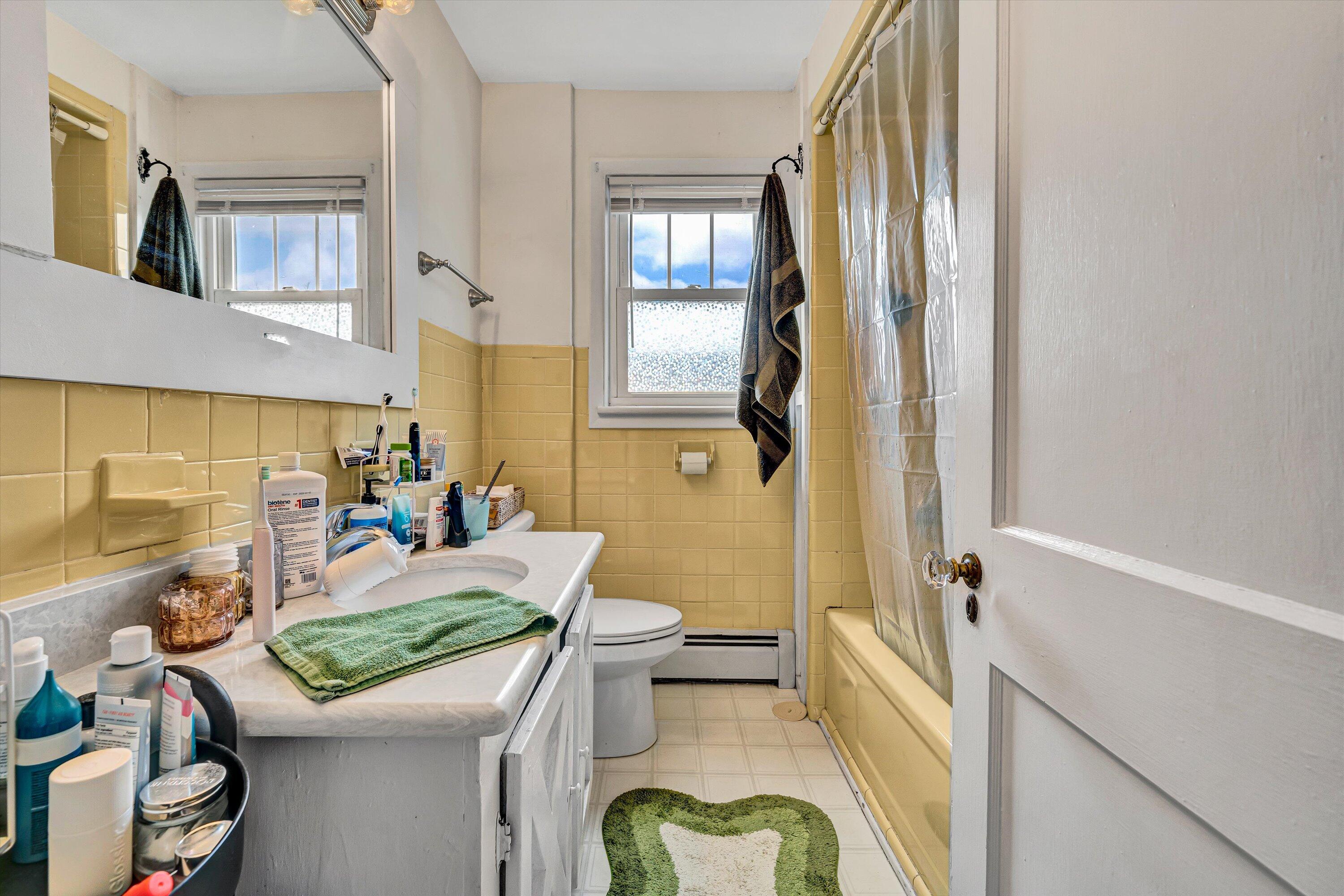 1907 Canterbury Road Southwest Roanoke, VA 24015 - Photo 23 of 36 a view of a bathroom with tub and shower