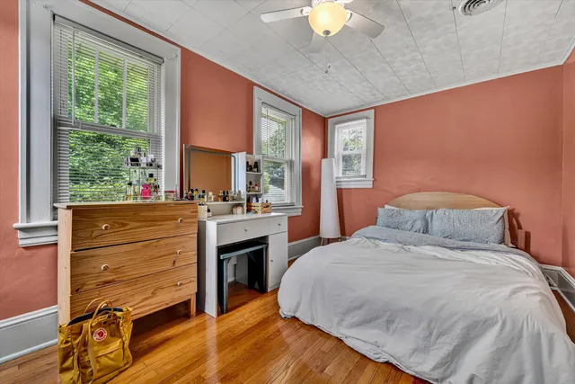 a bedroom with a bed and a fireplace